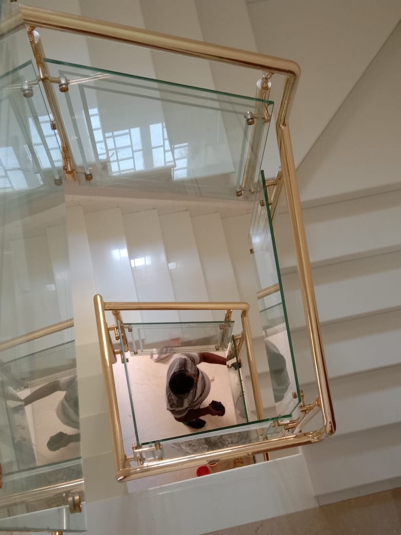 Brass & glass spiral railing